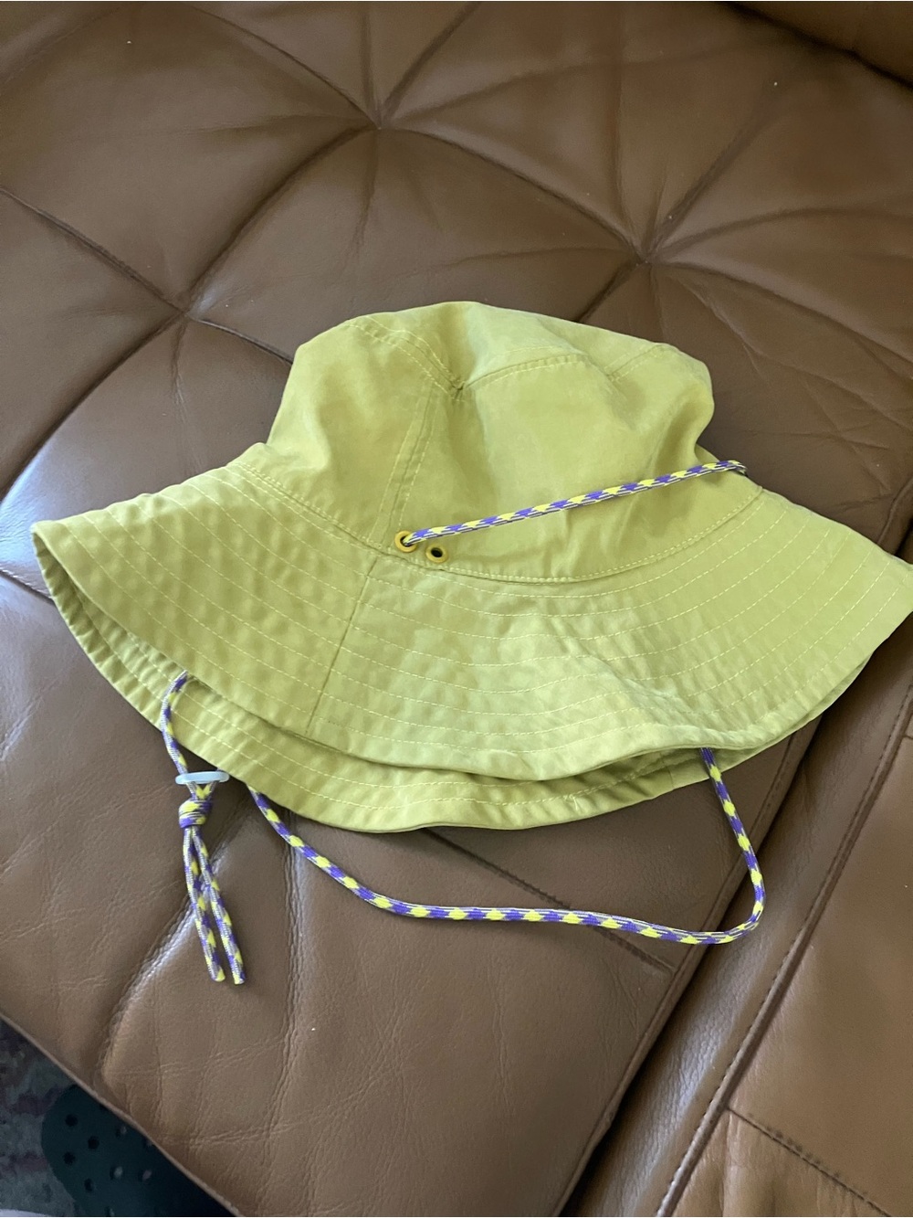 Zara women's yellow bucket hat with purple adjustable cord